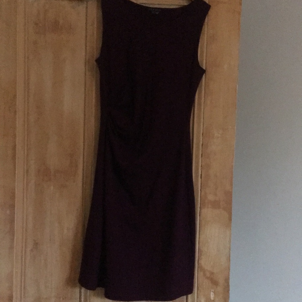 Mid length , light wool dress. Pleated waist .